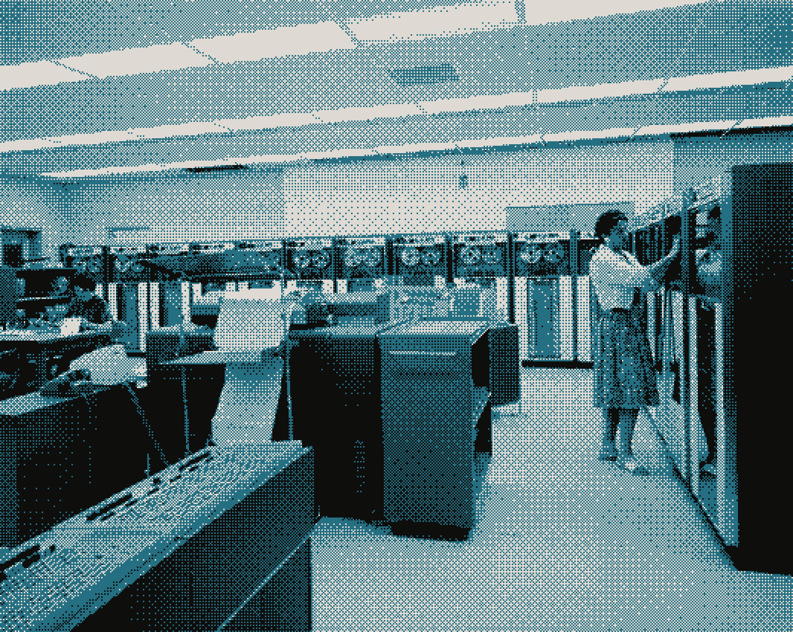 Operators at the tape drives and consoles of a 1963 data processing room