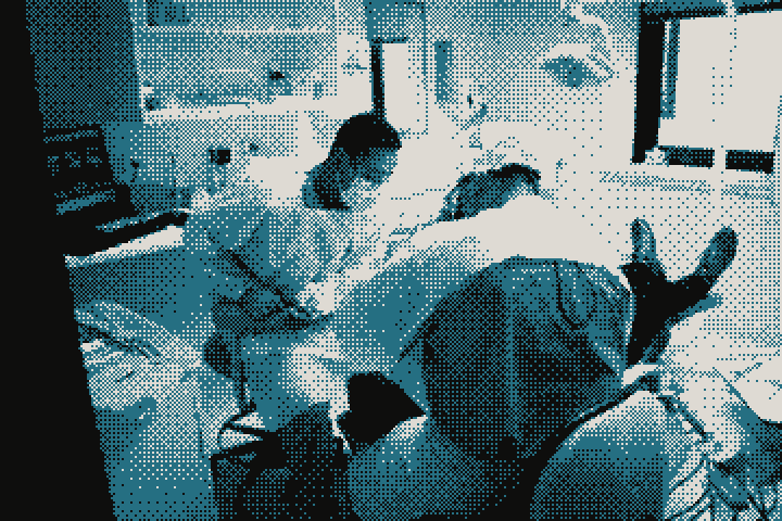 A dentist and assistant treating a patient under the dental light