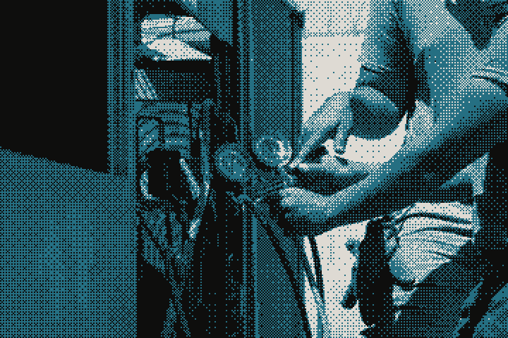 A technician connecting gauges to an air-conditioning unit