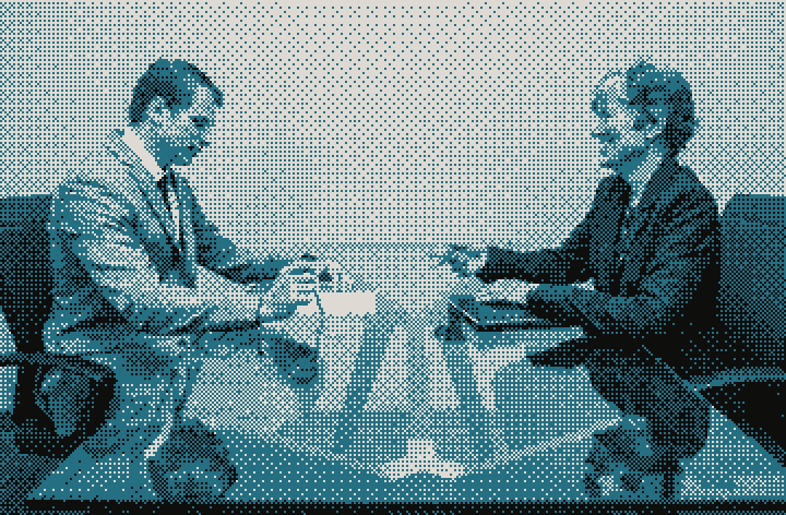 A candidate and interviewer across a table with a CV