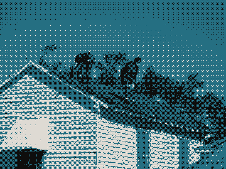 Two roofers stripping shingles on a pitched roof